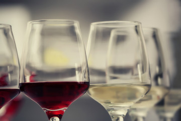 Wine glasses with red and white wine, closeup