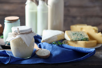 Set of dairy products on wooden table closeup