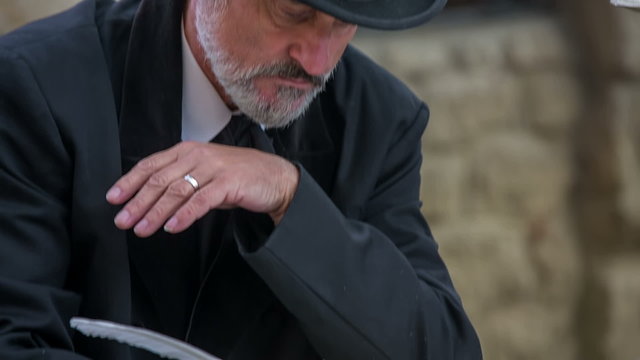Man from romantic times writing a classic song 