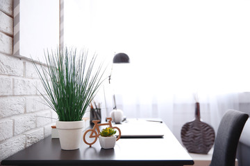 Workplace with laptop on table at home