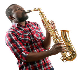 Obraz na płótnie Canvas African American jazz musician playing the saxophone, isolated on white