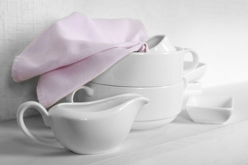 Tableware with napkin on a white background, close up