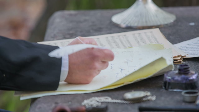 Composer writing a poem at stone table
