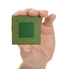 Male hand holding microprocessor on white background