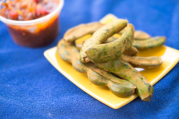 Fresh Tamarind and sweet sauce on blue