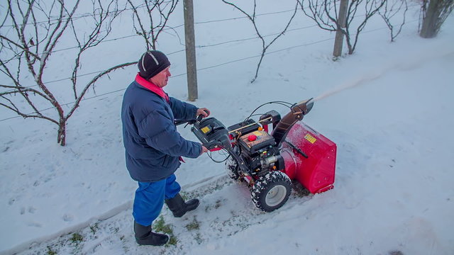 Walking with a snowblower