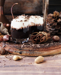 hot chocolate in glass cups and cream with nuts