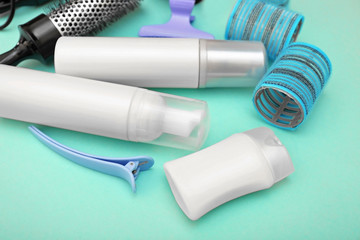 Hairdresser set with various accessories on turquoise background