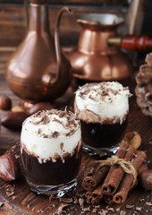 hot chocolate in glass cups and cream with nuts