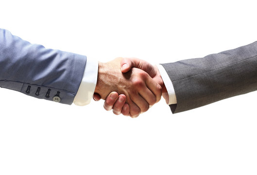 handshake of business partners after signing promising contract