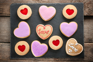 Obraz na płótnie Canvas Assortment of love cookies on grey stand