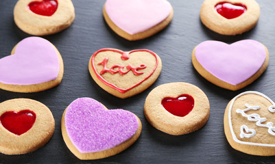 Assortment of love cookies on grey background