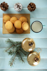 Christmas composition with cookies and decorations on a blue table