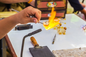 A photo of hand worker Glass blowing