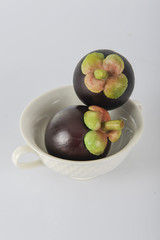 asian tropical mangosteen fruit on white background