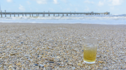 The glass of beer on the seafront