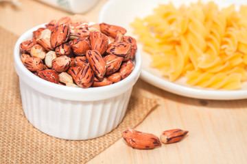 Tiger peanut in bowl on wood table