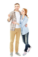 Happy young couple with keys from new house isolated on white