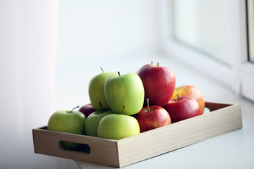 Ripe apples on windowsill