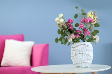 Beautiful bouquet of roses in room interior