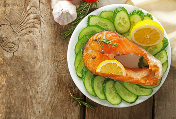 Fish with vegetables on plate