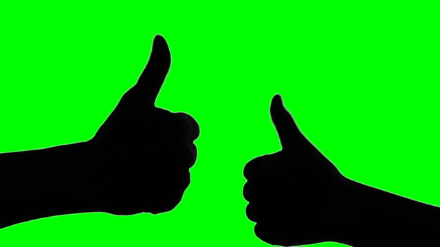 Silhouette of two hand thumbs up on green screen background
