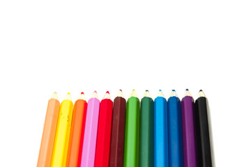 Colorful wooden crayon on white background.