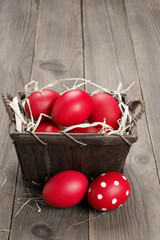 Red Easter eggs in basket