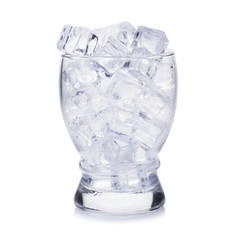 Glass of ice cubes on white background