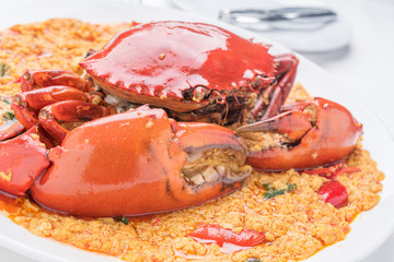 Stir-fried crab curry on white dish, famous food of Asian