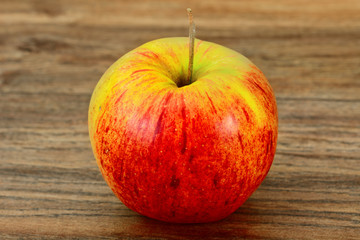 Red Apple on Woody Background. 