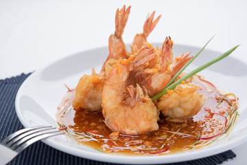 sweet and sour sauce with prawn, isolated background