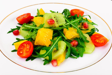 Fresh mango, arugula, kiwi, orange and pomegranate.