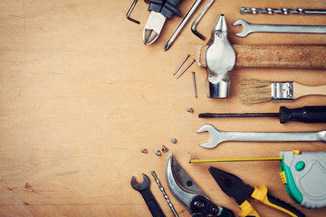 Working tools on wooden rustic background, top view - Powered by Adobe
