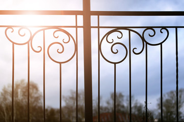 sunset and wrought gate