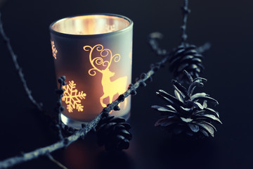 evening candle in glass fir-cone