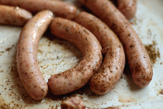 preparing sausages on fire