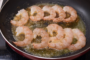 Shrimps on a skillet. Process of cooking