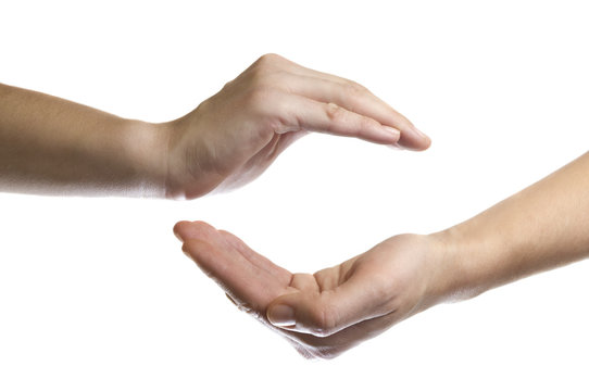 isolated image of two hands facing each other as a symbol of protection and insurance
