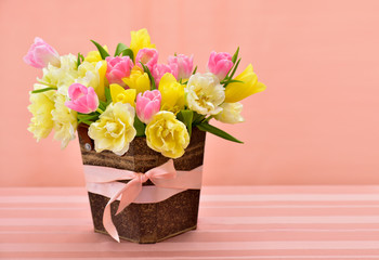 Fototapeta na wymiar Beautiful spring bouquet in vintage bucket on the table. Bright