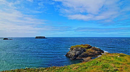Cliffs along Irish Coast next to tiny Carrick-a-rede island