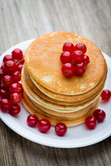 Stack of pancakes with blueberry and fresh berry.