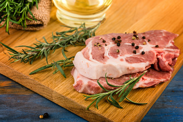 fresh raw  steak with aromatic rosemary and spices, cooking concept.