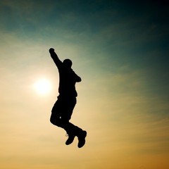 Fototapeta na wymiar Flying man. Young man falling down on sky background.