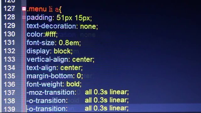 Hexadecimal code running up a computer screen. Close-up shot. Shallow depth.