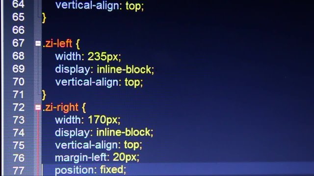 Hexadecimal code running up a computer screen. Close-up shot. Shallow depth.
