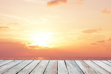 Naklejka na ściany i meble Wooden floor.Background sunset over the sea