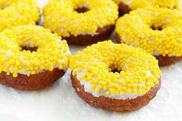 Close up of banana donuts on a white background