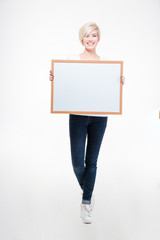 Pretty woman holding blank board