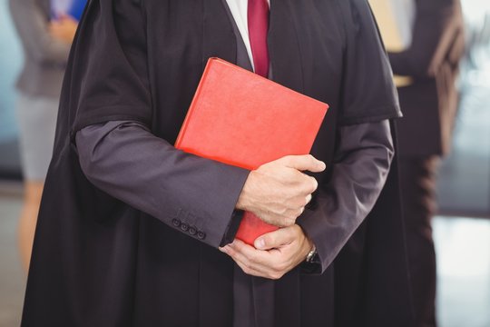 Lawyer holding a law book